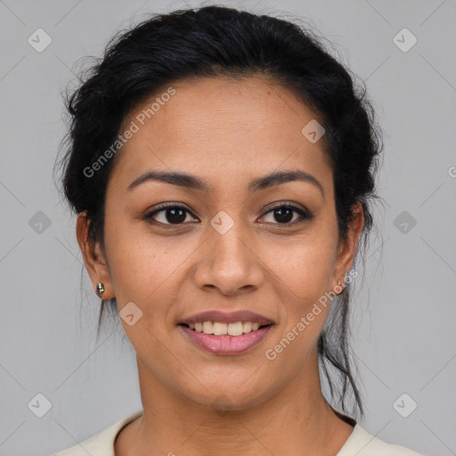 Joyful latino young-adult female with short  black hair and brown eyes