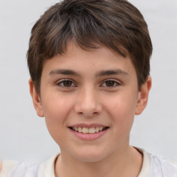 Joyful white child male with short  brown hair and brown eyes