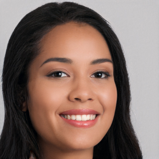 Joyful white young-adult female with long  black hair and brown eyes