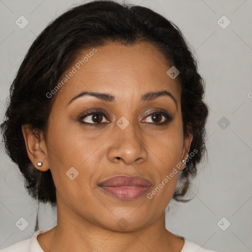 Joyful latino adult female with medium  brown hair and brown eyes