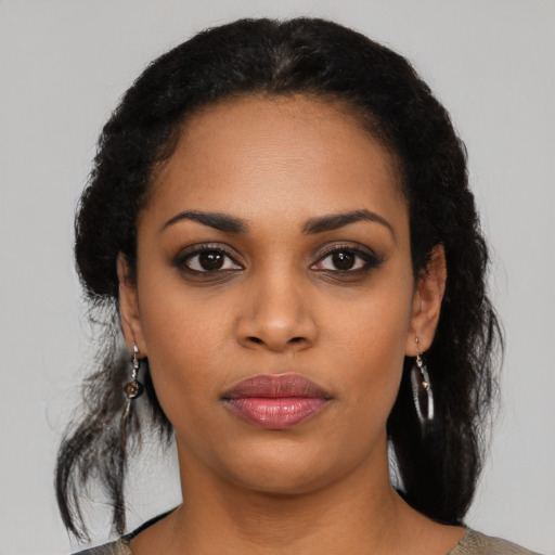Neutral black young-adult female with medium  black hair and brown eyes