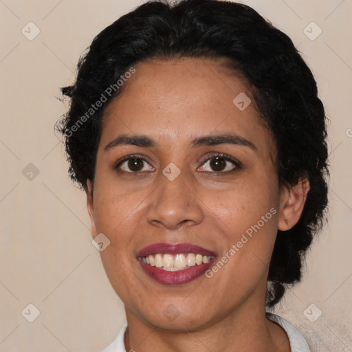 Joyful latino young-adult female with short  black hair and brown eyes