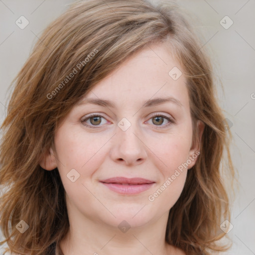 Joyful white young-adult female with medium  brown hair and blue eyes