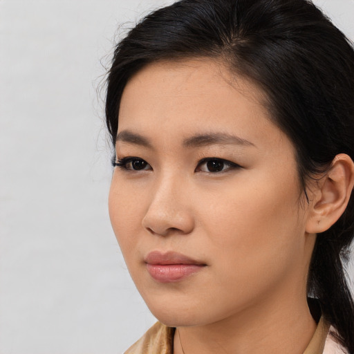 Neutral asian young-adult female with medium  brown hair and brown eyes