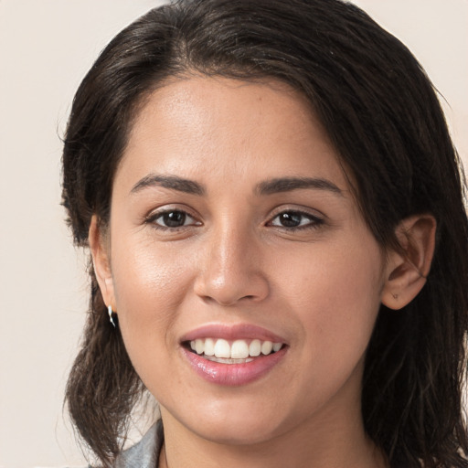 Joyful white young-adult female with medium  brown hair and brown eyes