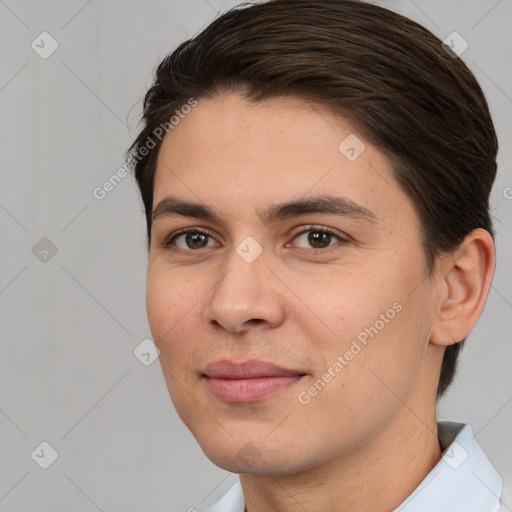 Joyful white young-adult male with short  brown hair and brown eyes