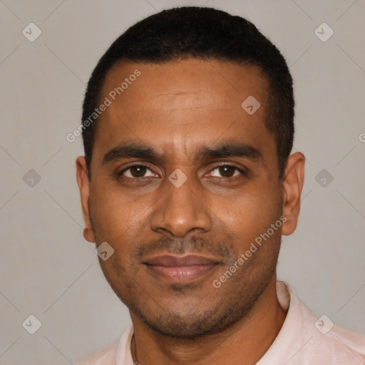 Joyful black young-adult male with short  black hair and brown eyes