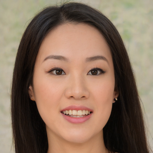 Joyful asian young-adult female with long  brown hair and brown eyes