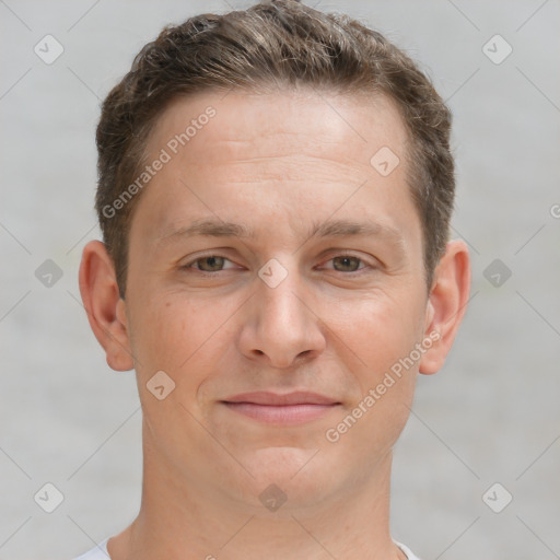 Joyful white adult male with short  brown hair and brown eyes