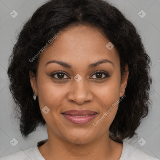 Joyful black adult female with medium  brown hair and brown eyes