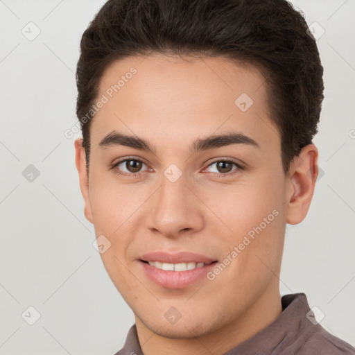 Joyful white young-adult male with short  brown hair and brown eyes