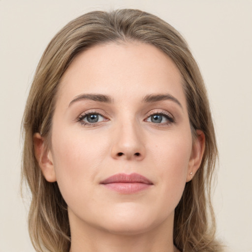 Joyful white young-adult female with long  brown hair and grey eyes