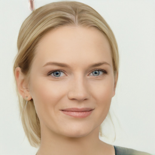 Joyful white young-adult female with medium  brown hair and blue eyes