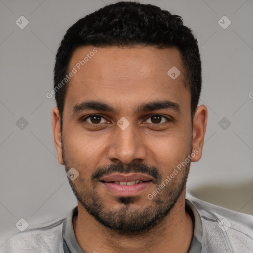 Joyful latino young-adult male with short  black hair and brown eyes