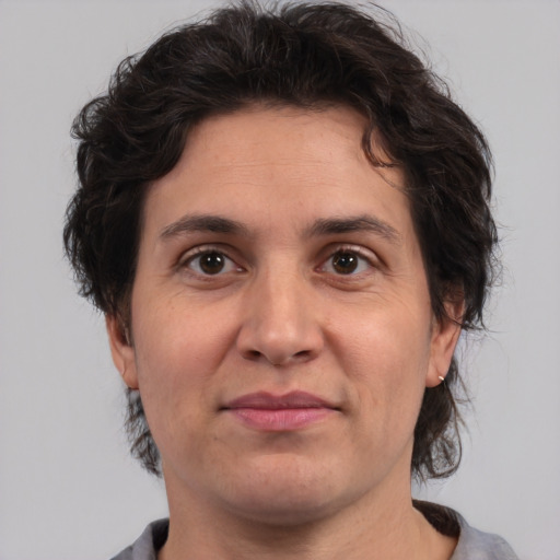 Joyful white adult male with medium  brown hair and brown eyes