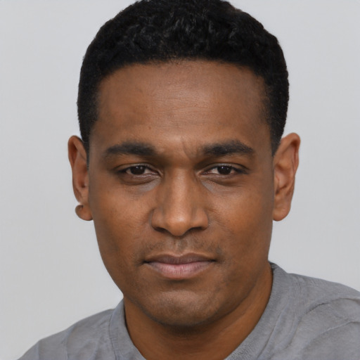 Neutral black young-adult male with short  black hair and brown eyes