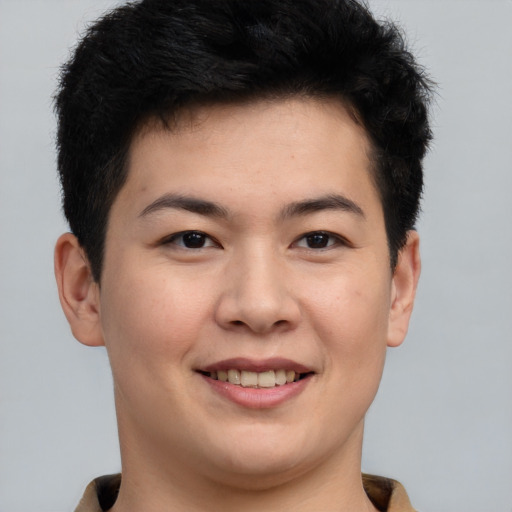 Joyful asian young-adult male with short  brown hair and brown eyes