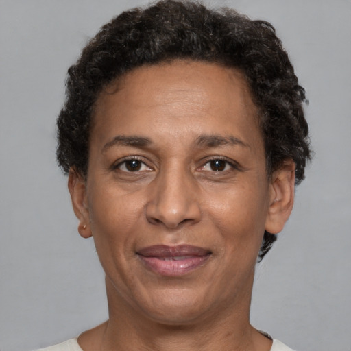 Joyful latino adult female with short  brown hair and brown eyes