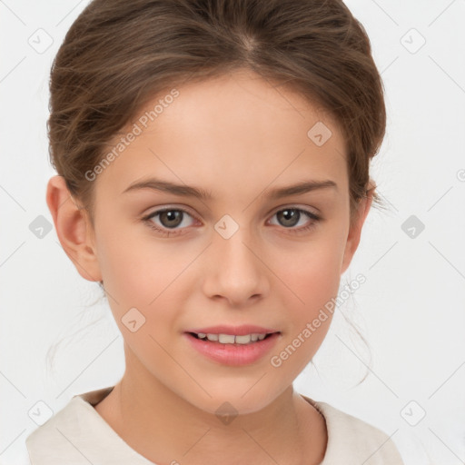 Joyful white child female with short  brown hair and brown eyes