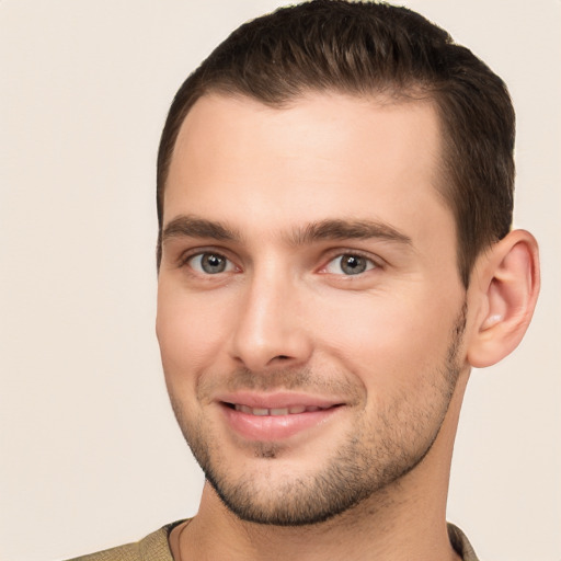 Joyful white young-adult male with short  brown hair and brown eyes