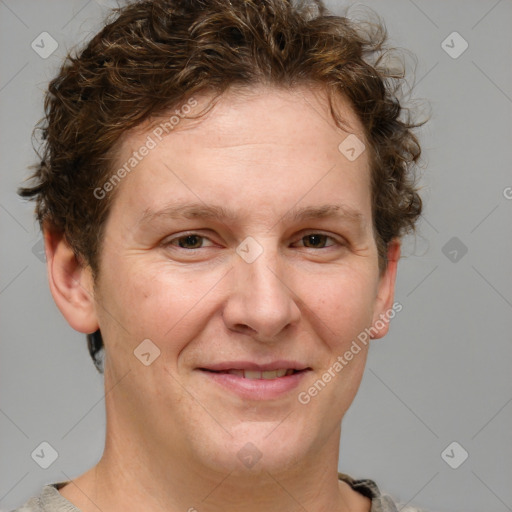 Joyful white adult female with short  brown hair and grey eyes