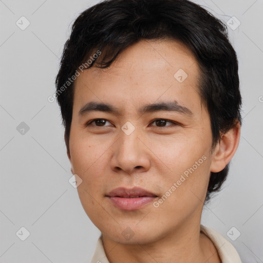 Joyful asian young-adult male with short  black hair and brown eyes