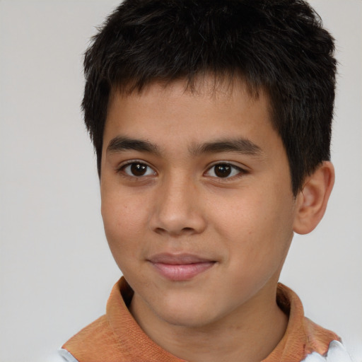 Joyful white child male with short  brown hair and brown eyes