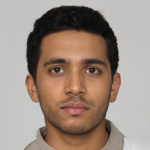 Neutral latino young-adult male with short  black hair and brown eyes