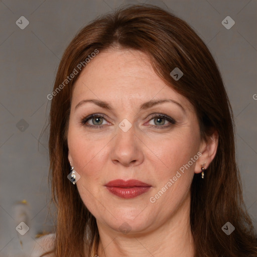 Joyful white adult female with medium  brown hair and brown eyes