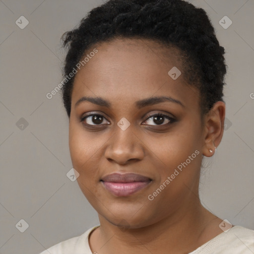 Joyful black young-adult female with short  brown hair and brown eyes