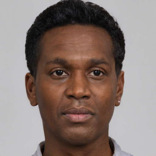 Neutral black young-adult male with short  black hair and brown eyes