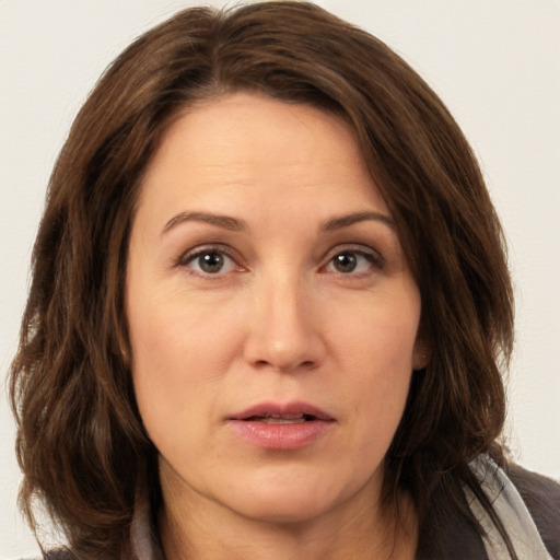 Neutral white adult female with medium  brown hair and brown eyes