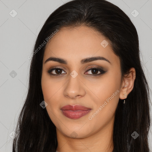 Joyful latino young-adult female with long  brown hair and brown eyes