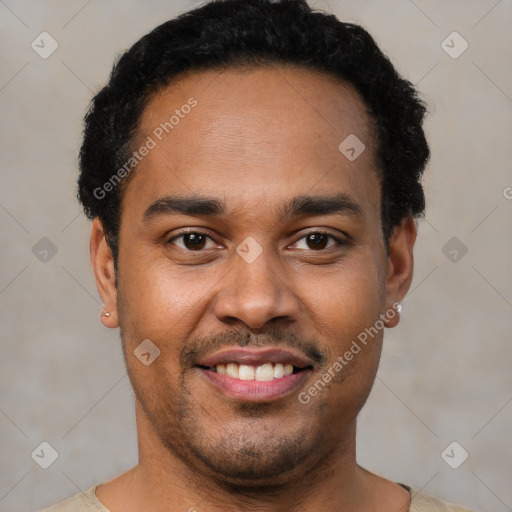 Joyful latino young-adult male with short  brown hair and brown eyes