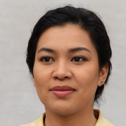 Joyful asian young-adult female with medium  brown hair and brown eyes