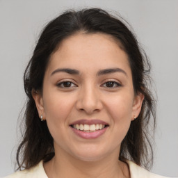 Joyful white young-adult female with medium  brown hair and brown eyes