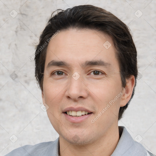 Joyful white adult male with short  brown hair and brown eyes