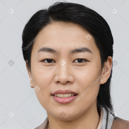 Joyful asian young-adult female with medium  brown hair and brown eyes