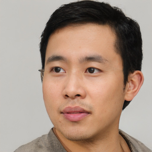 Neutral asian young-adult male with short  black hair and brown eyes