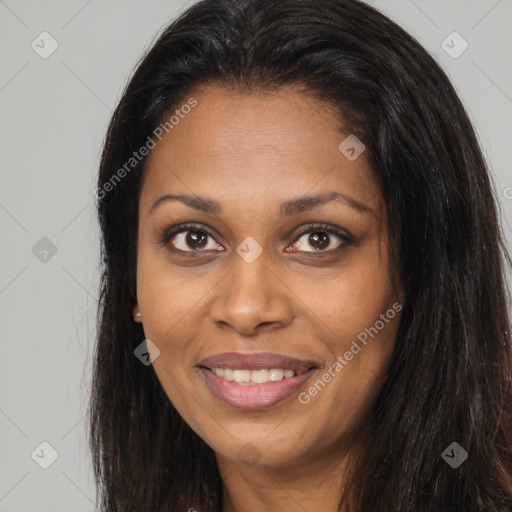 Joyful black young-adult female with long  brown hair and brown eyes