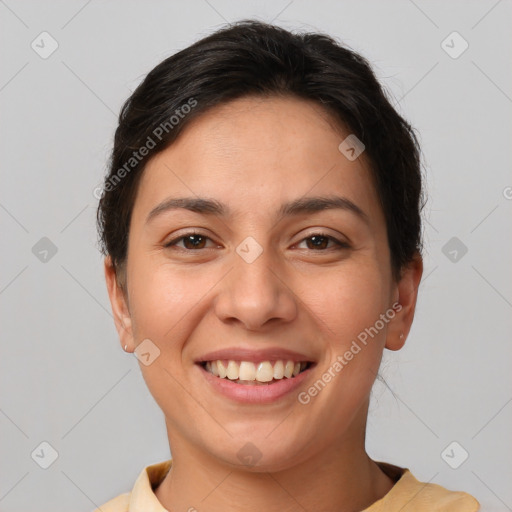 Joyful white young-adult female with short  brown hair and brown eyes