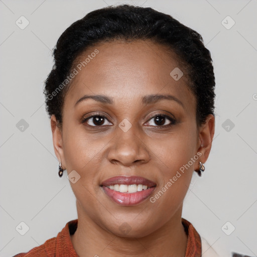 Joyful black young-adult female with short  brown hair and brown eyes