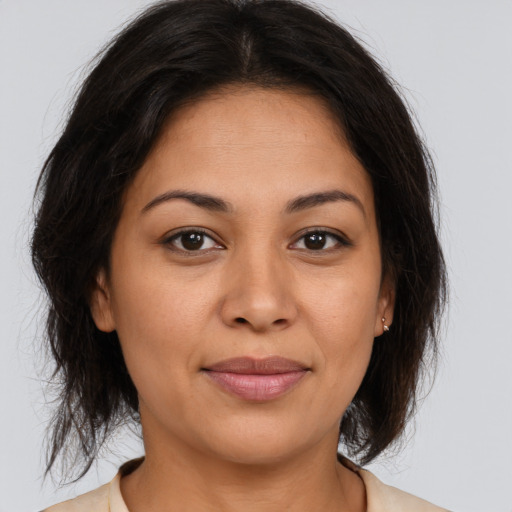 Joyful asian young-adult female with medium  brown hair and brown eyes