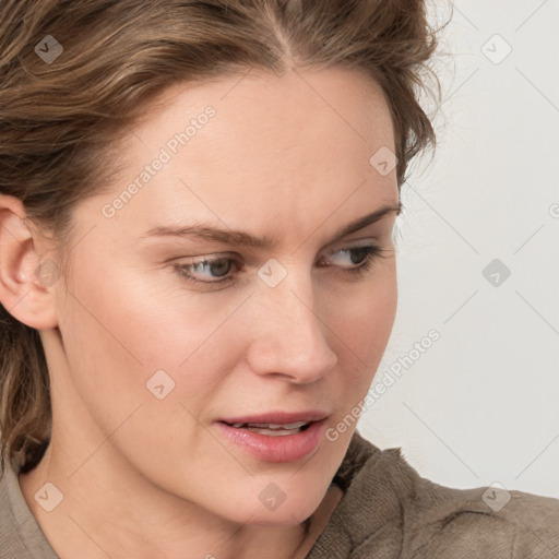 Joyful white young-adult female with medium  brown hair and blue eyes