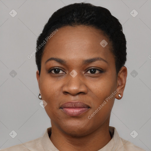 Joyful black young-adult female with short  black hair and brown eyes