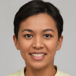 Joyful asian young-adult female with short  brown hair and brown eyes