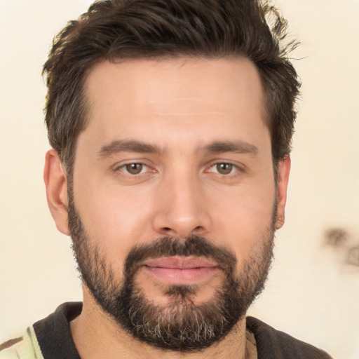 Joyful white young-adult male with short  brown hair and brown eyes