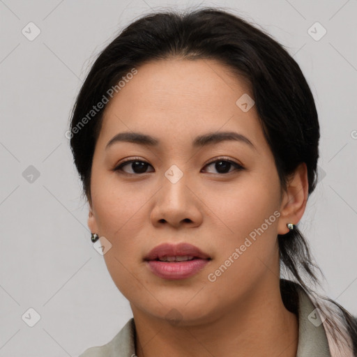 Joyful asian young-adult female with medium  brown hair and brown eyes