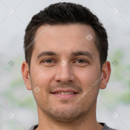 Joyful white young-adult male with short  brown hair and brown eyes