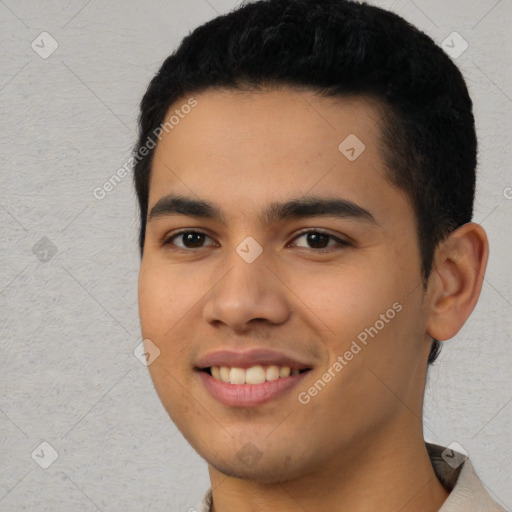 Joyful latino young-adult male with short  black hair and brown eyes